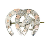 silver horse shoe brooch